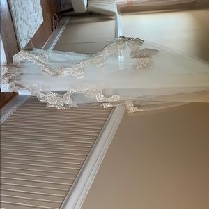 Off white cathedral bridal veil with lace trimming